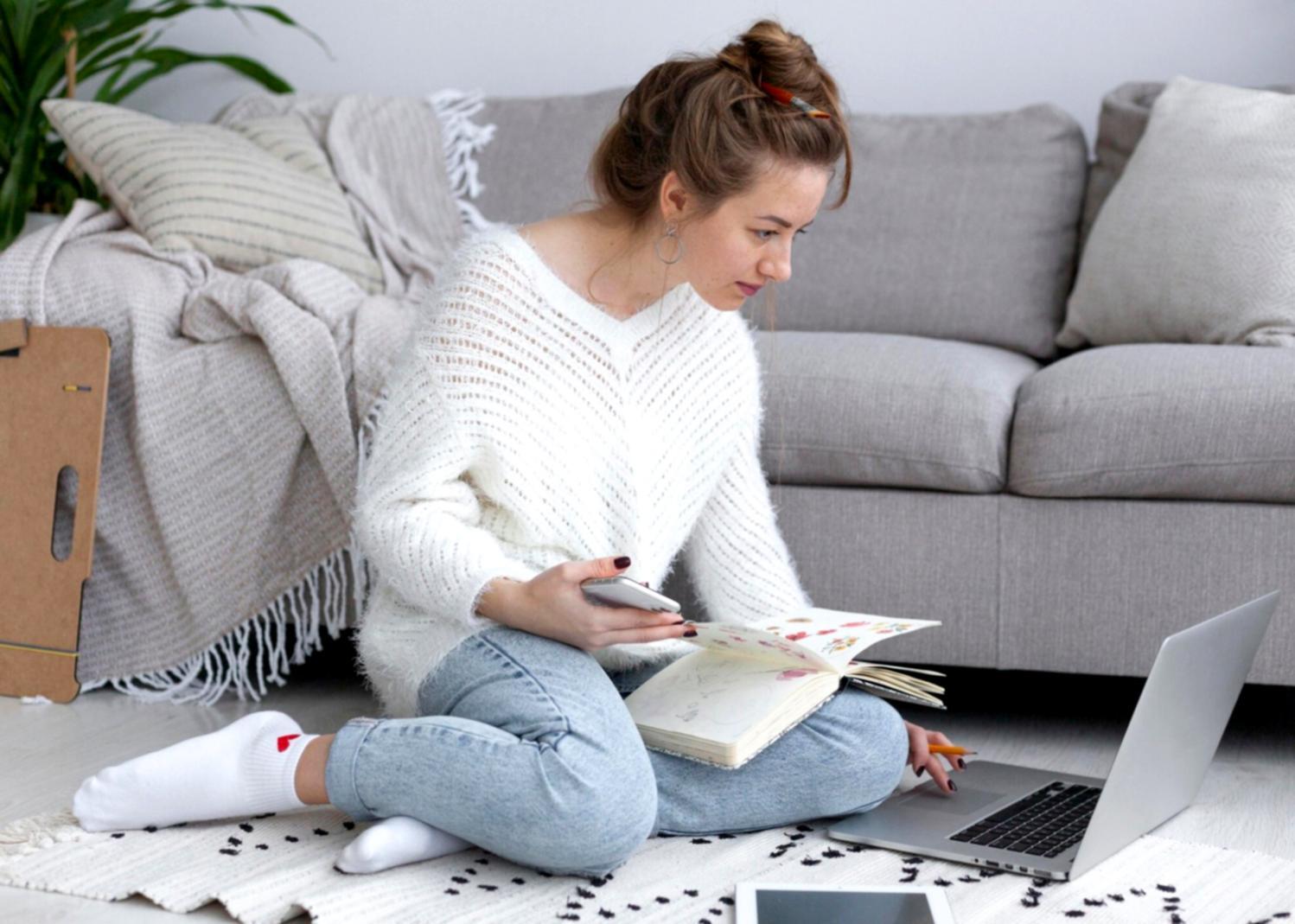 Study materials and resources spread across a desk showing financial planning documents and analysis tools